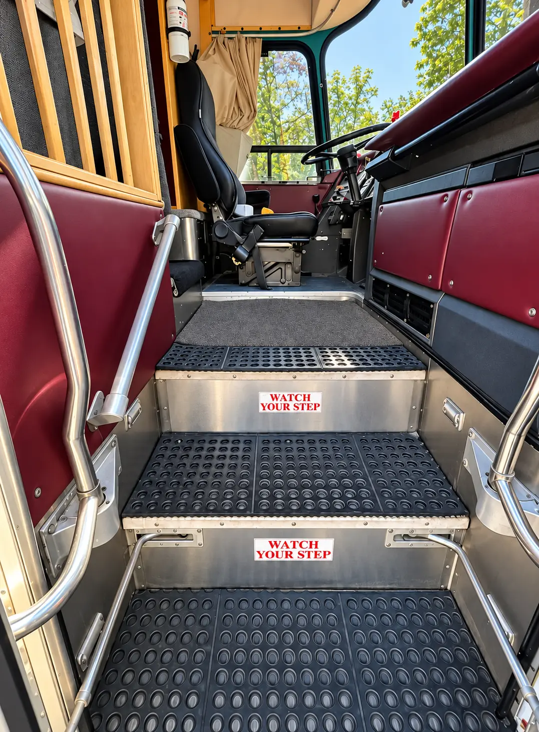 Entry steps and handrails leading into the vintage Eagle tour bus